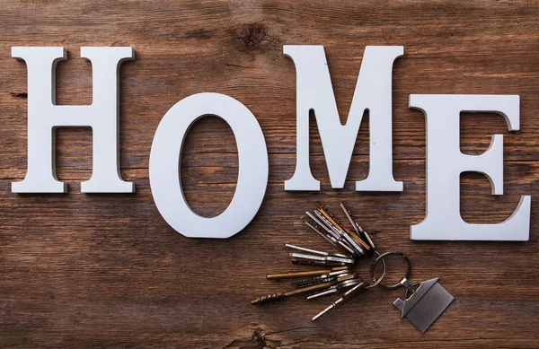 Letras blancas con palabra HOME — Foto de Stock