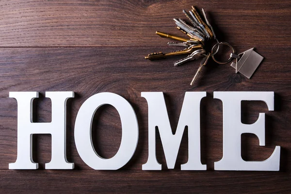 Letras blancas con palabra HOME — Foto de Stock
