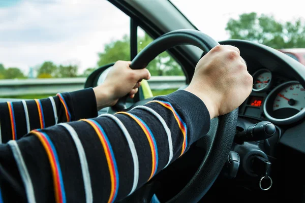 Male hands on steering wheel — Stock Photo, Image