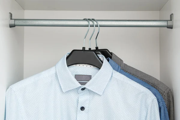 Different shirts in the closet — Stock Photo, Image