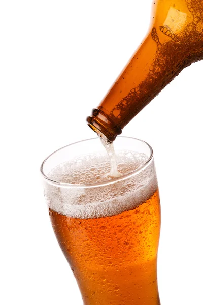 Beer is pouring into a glass — Stock Photo, Image