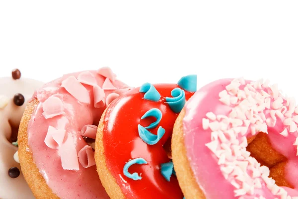 Donuts colorés sur fond — Photo
