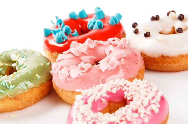 Donuts coloridos no fundo — Fotografia de Stock