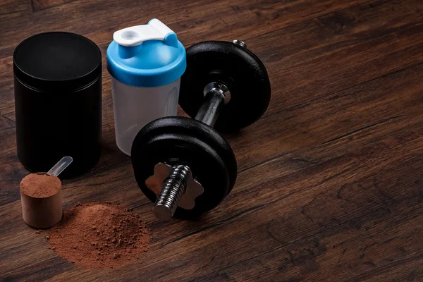 Dumbell and protein powder — Stock Photo, Image