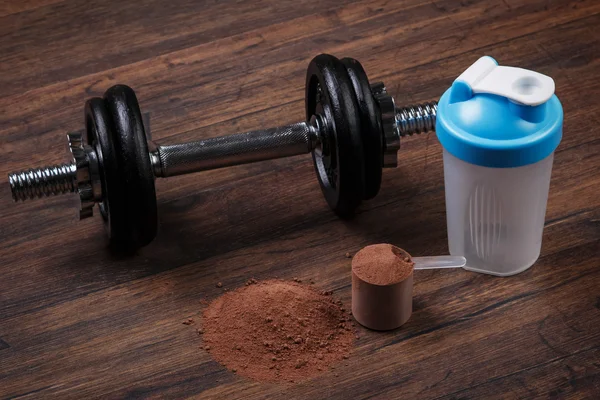 Dumbell and protein powder — Stock Photo, Image