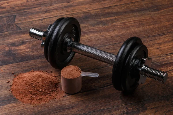 Dumbell en eiwit poeder — Stockfoto