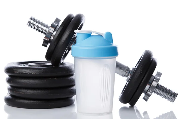 Dumbbell and shaker for protein cocktail — Stock Photo, Image
