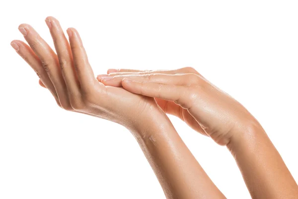 Female hands and moisturizing cream — Stock Photo, Image