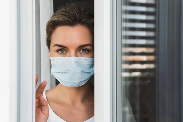 Young Scared Woman Wearing Prevention Mask Looking Window — Stock Photo, Image