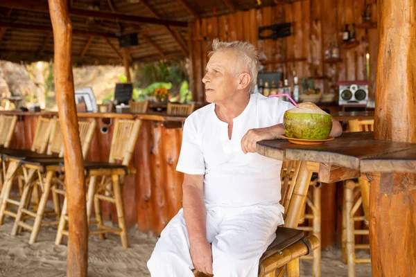 Enjoying Retirement Happy Senior Man Drinking Coconut Water Beach Bar — Stock Photo, Image