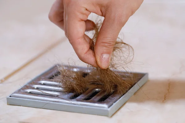 Woman Removing Hair Clump Shower Drain Cleaning Hair Loss Concept — Stock Photo, Image