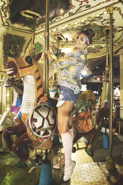 Stylish Woman Wearing Sparkling Jacket Carousel Theme Park — Stock Photo, Image