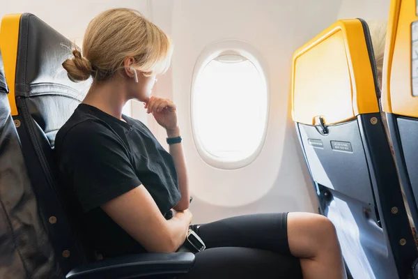 Young Woman Listening Music Airplane Her Flight — Stock Photo, Image