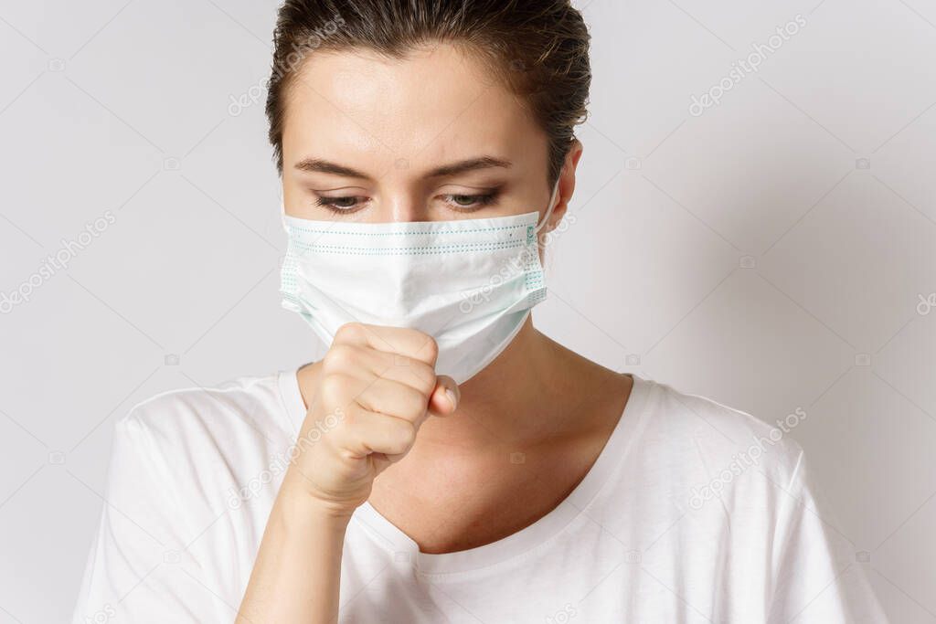 Young caucasian woman is wearing a face mask for protection against virus