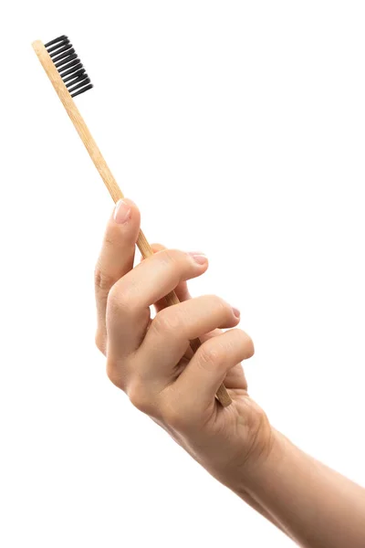 Γυναικείο Χέρι Μια Οικολογική Οδοντόβουρτσα Μπαμπού Λευκό Φόντο — Φωτογραφία Αρχείου