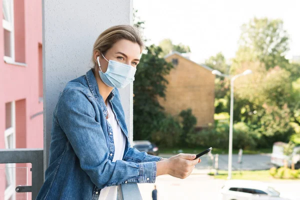 Young Woman Prevention Mask Her Face Using Smartphone — Stock Photo, Image