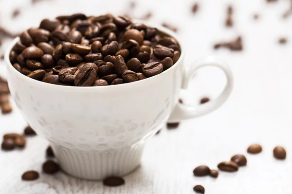 Cup and coffee beans — Stock Photo, Image