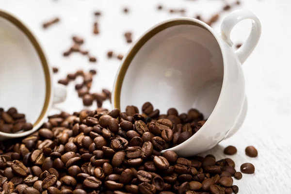 Cup and coffee beans — Stock Photo, Image