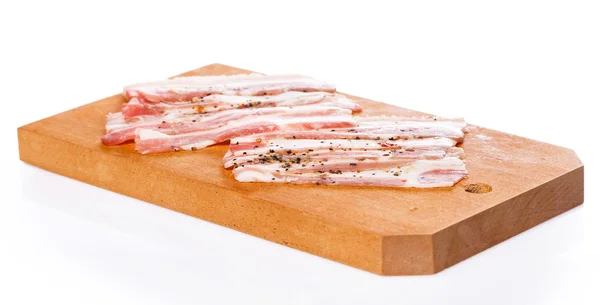 Speck auf Holzbrett — Stockfoto