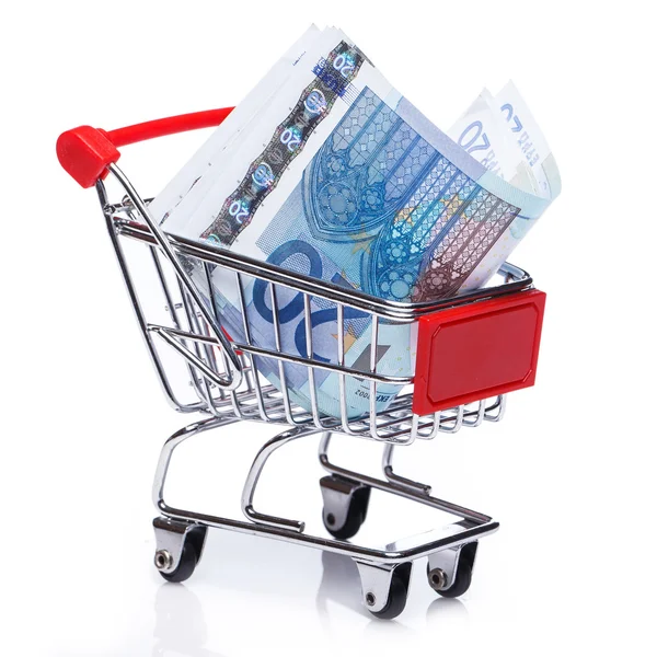 Billetes en un pequeño carrito de compras —  Fotos de Stock