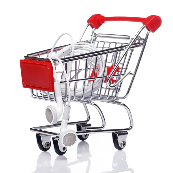 Shopping trolley and earphones — Stock Photo, Image