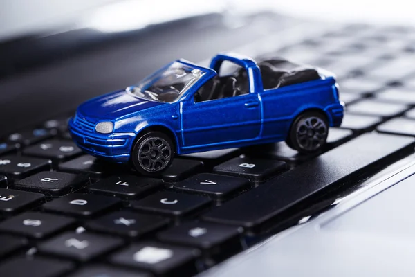 Toy car over keyboard — Stock Photo, Image