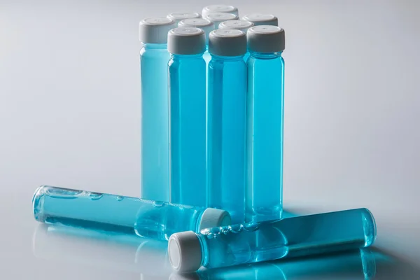 Botellas con líquido azul — Foto de Stock