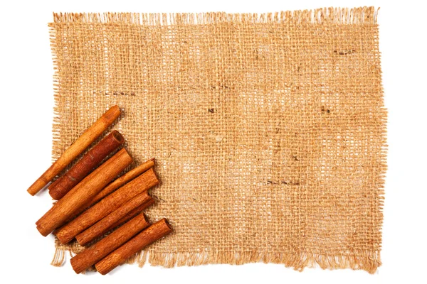 Cinnamon on sackcloth — Stock Photo, Image