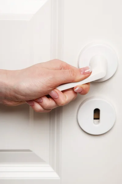 Female hand on door handle — Stock Photo, Image