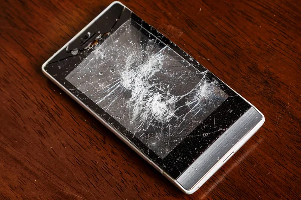 Damaged display on smartphone — Stock Photo, Image