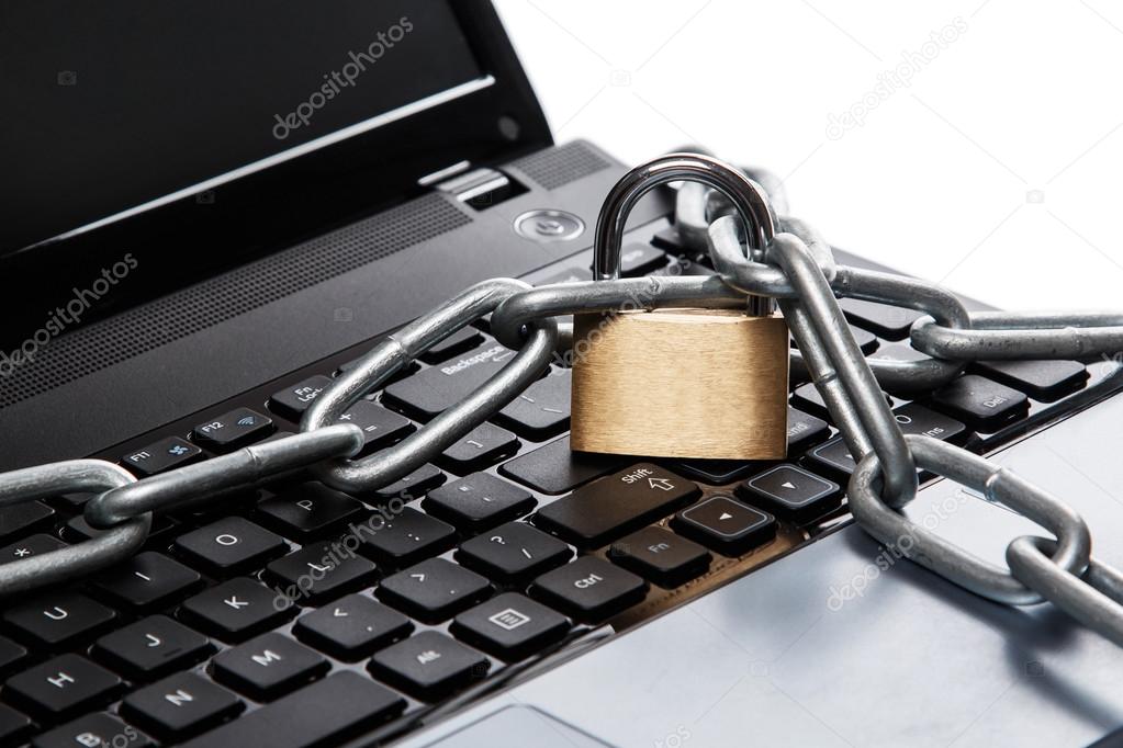 Padlock and chain on keyboard