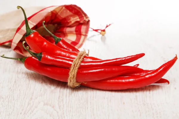 Chili peppers in sack — Stock Photo, Image