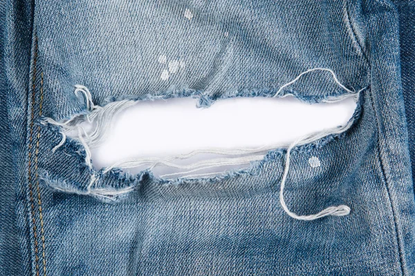 Jeans texutre with a hole — Stock Photo, Image