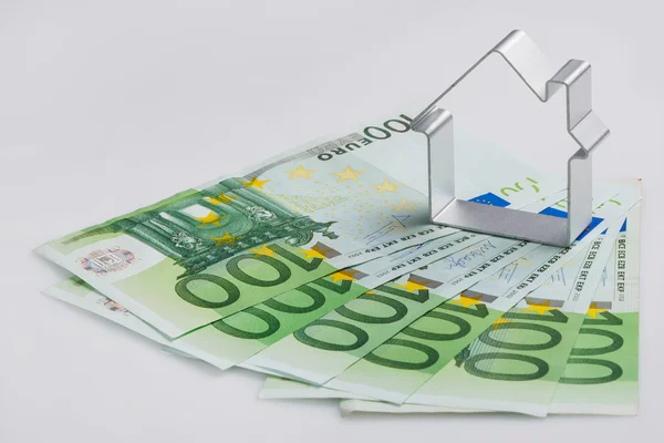 Shape of house and money — Stock Photo, Image