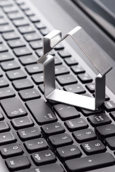 Shape of a houses over keyboard — Stock Photo, Image