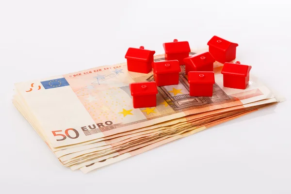 Small toy houses and money — Stock Photo, Image