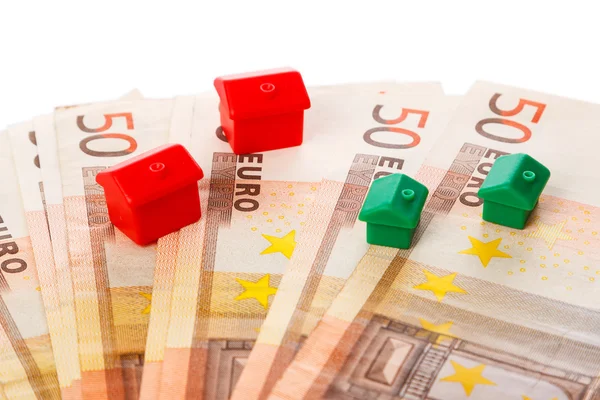 Small toy houses and money — Stock Photo, Image