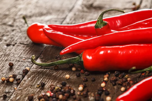 Red chili pepper and different types of grains — Stock Photo, Image