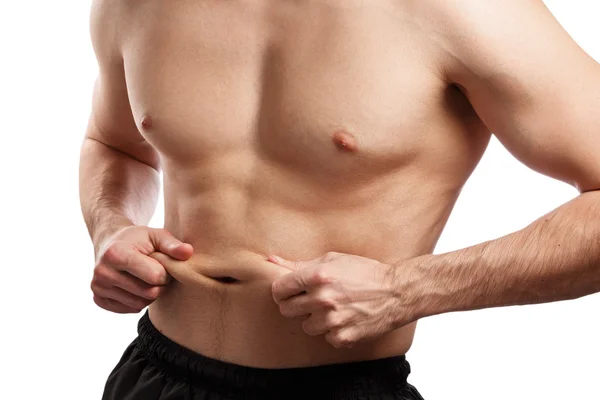 Homem está segurando gordura em sua barriga — Fotografia de Stock