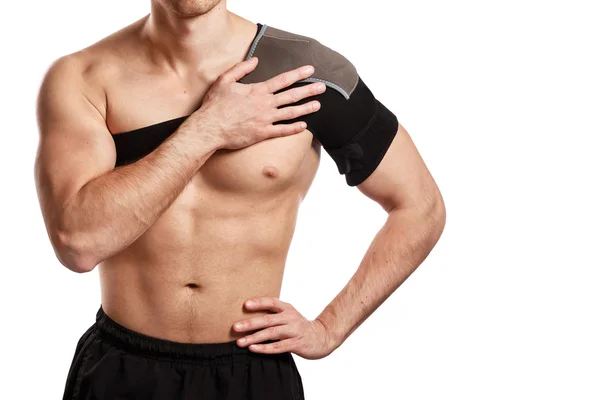 Sportsman with a support bandage on his shoulder — Stockfoto