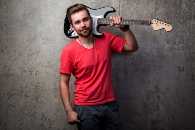 Handsome guy with electric guitar clipart