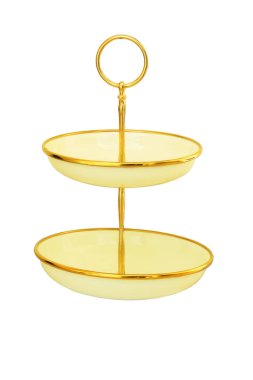 Eski tarz. Metal iki katlı tatlı standı beyaz arka planda. Kek standı altın renginde. Yemek servisi için tablo görüntüsü. 