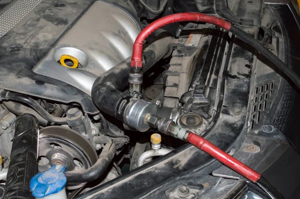 The hoses are connected to the cooling system of the automobile internal combustion engine