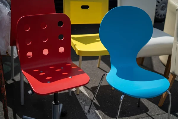 Designer chairs with different colours at a flea market in Hamburg, Germany
