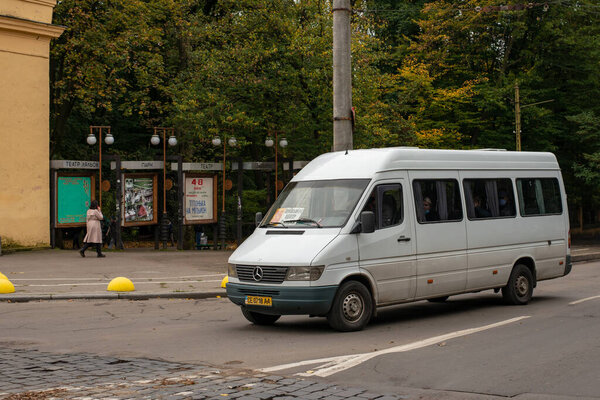 CHERNIVTSI, UKRAINE - October 16, 2020. Bus Mersedes-Benz 310D riding with passengers in the streets of Chernivtsi.