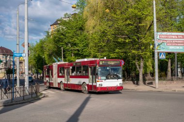 IVANO-FRANKIVSK, UKRAINE - May 09, 2021. Trolleybus Grf and Stift GE112 M16 #187 (ex. Salzburg #225) riding with passengers in the streets of Ivano-Frankivsk.
