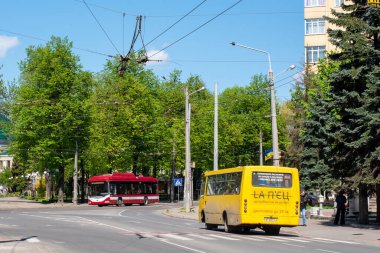 IVANO-FRANKIVSK, UKRAINE - May 09, 2021. Trolleybus BKM 321 #249 and bus Bogdan A092 riding with passengers in the streets of Ivano-Frankivsk.