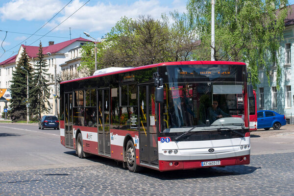 IVANO-FRANKIVSK, UKRAINE - May 09, 2021. Bus Bogdan A701 riding with passengers in the streets of Ivano-Frankivsk.