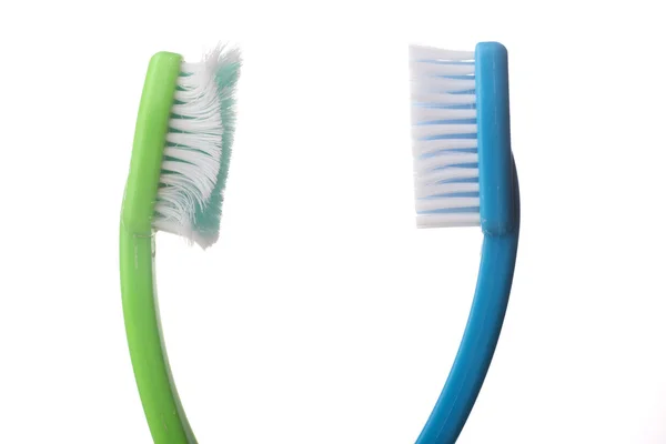 Used toothbrushes on white — Stock Photo, Image