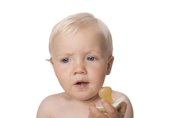 Surprised one year old boy with dummy — Stock Photo, Image